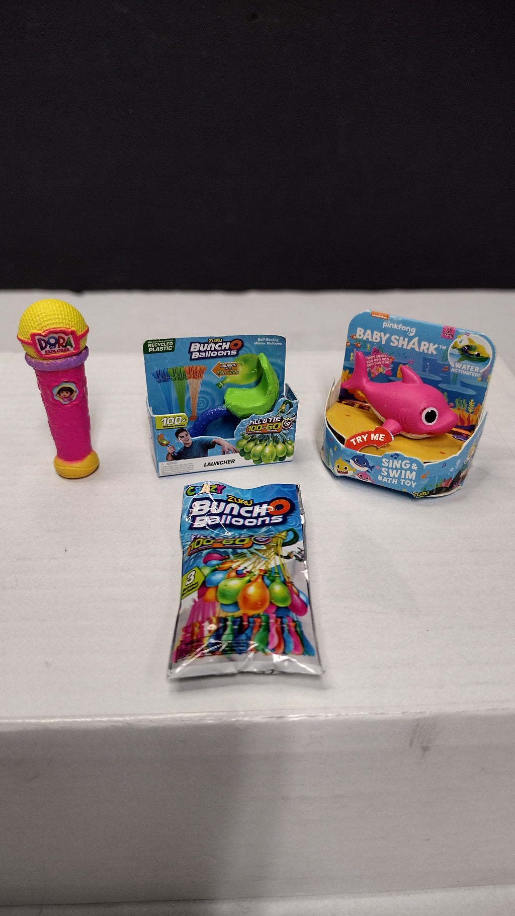 Zuru 5 Surprise Mini Brands- Toy Lot of 4 Items- Baby Shark- Balloons- Dora Microphone