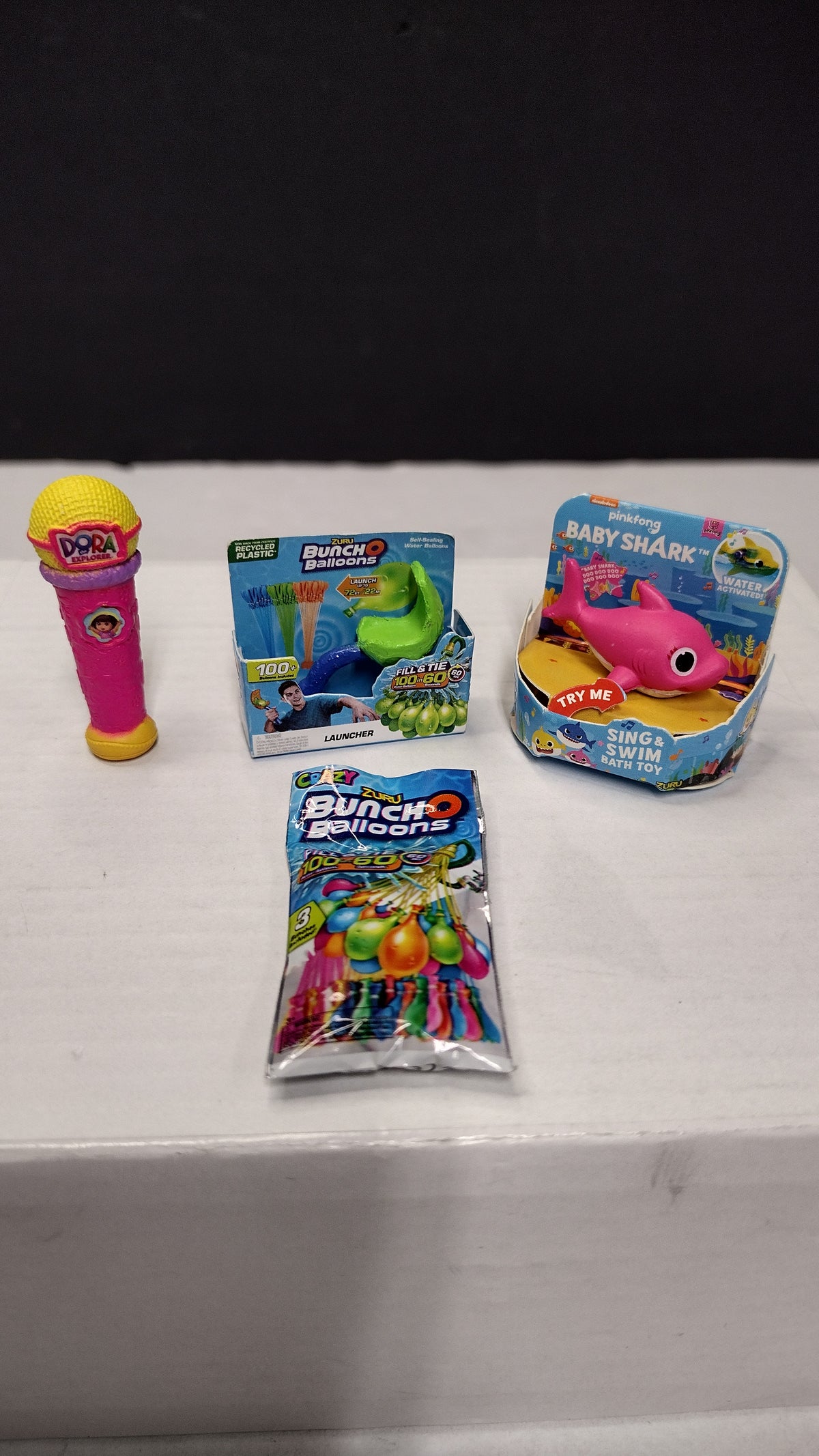 Zuru 5 Surprise Mini Brands- Toy Lot of 4 Items- Baby Shark- Balloons- Dora Microphone