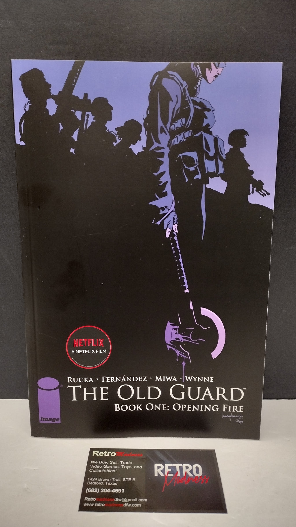 (MATURE) The Old Guard Book One: Opening Fire by Greg Rucka – New Paperback (Minor Wear)