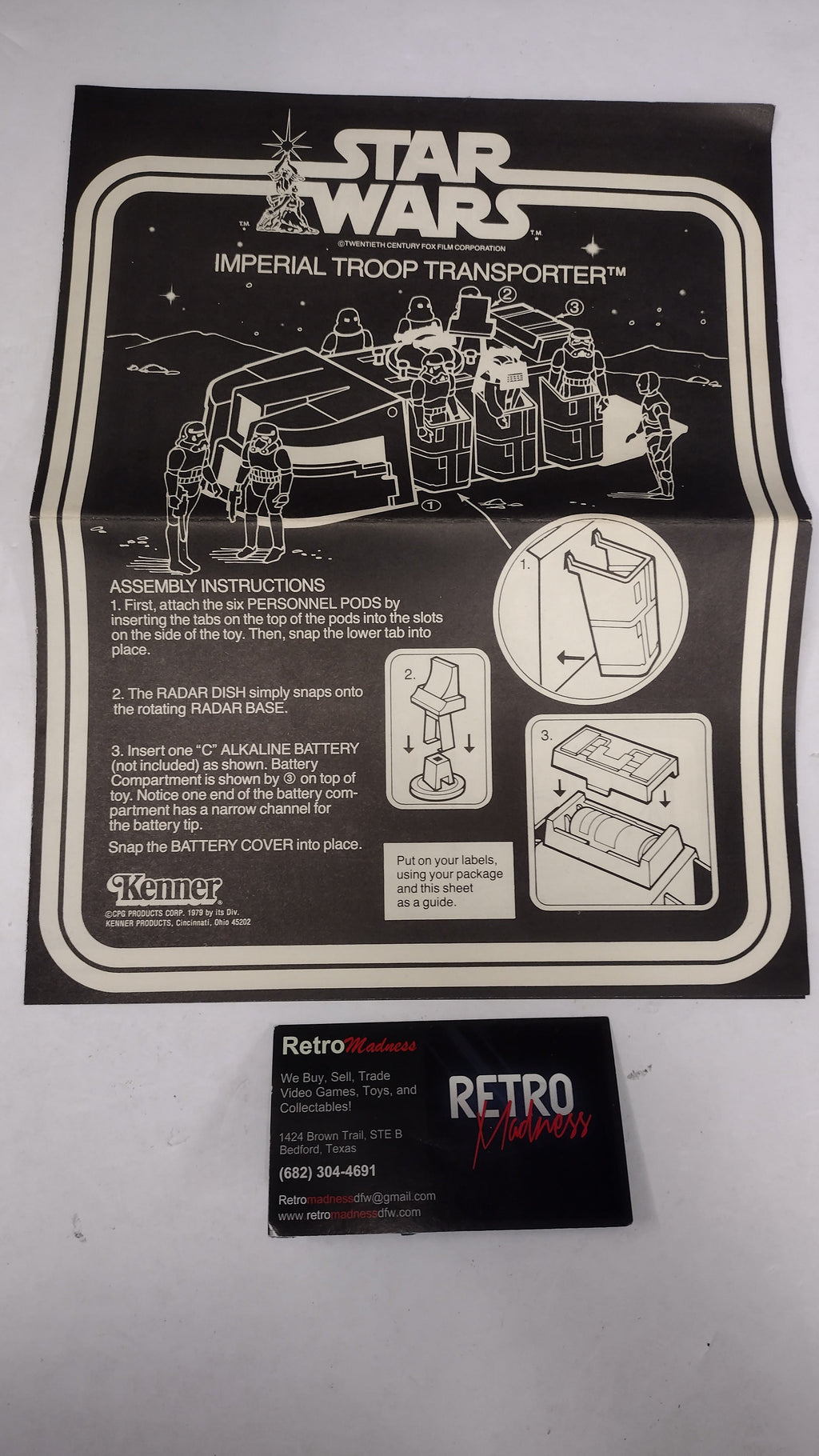 A vintage Star Wars Imperial Troop Transporter instruction booklet and a matching black retro card, displayed on a light gray background.