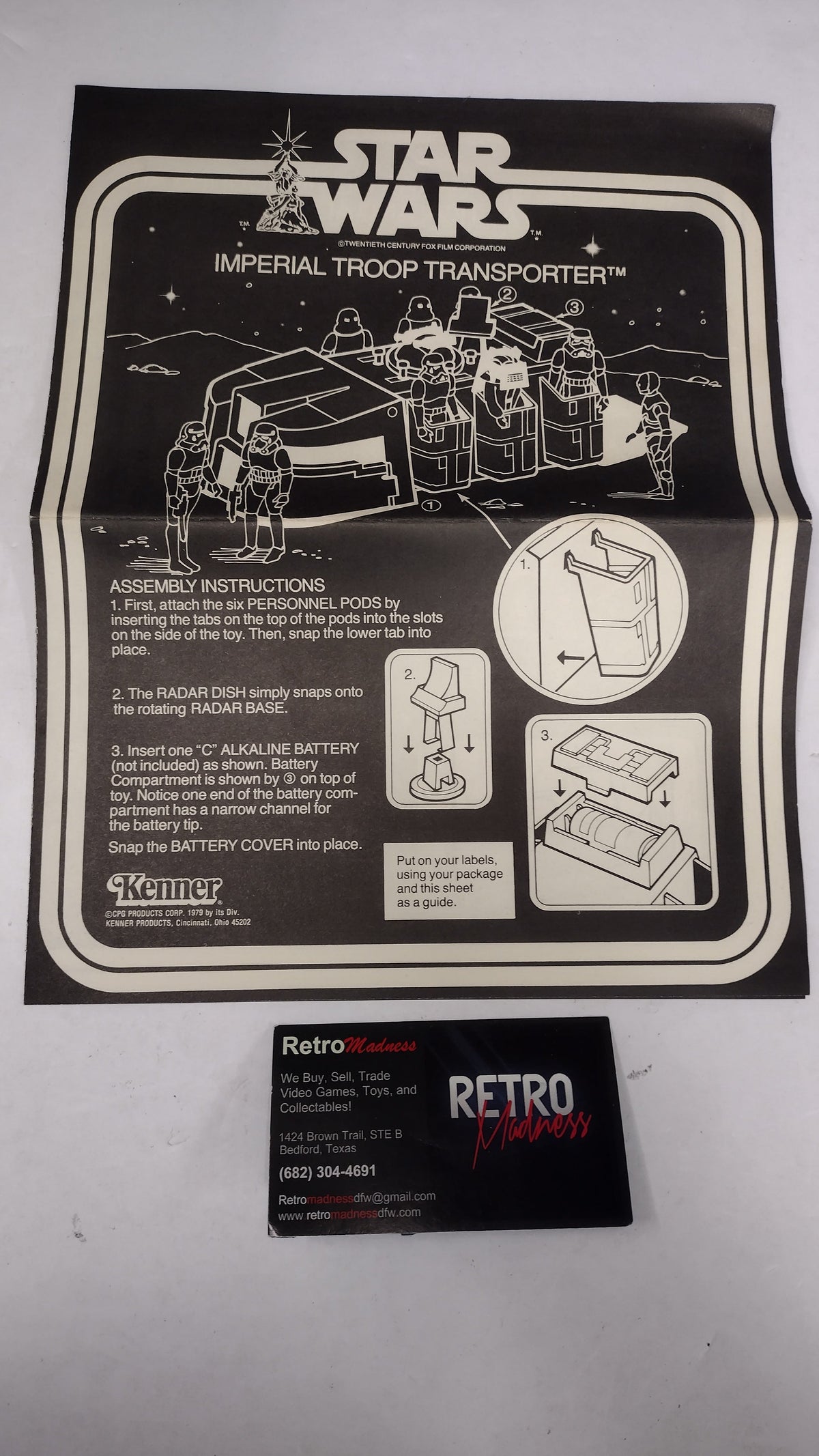 A vintage Star Wars Imperial Troop Transporter instruction booklet and a matching black retro card, displayed on a light gray background.