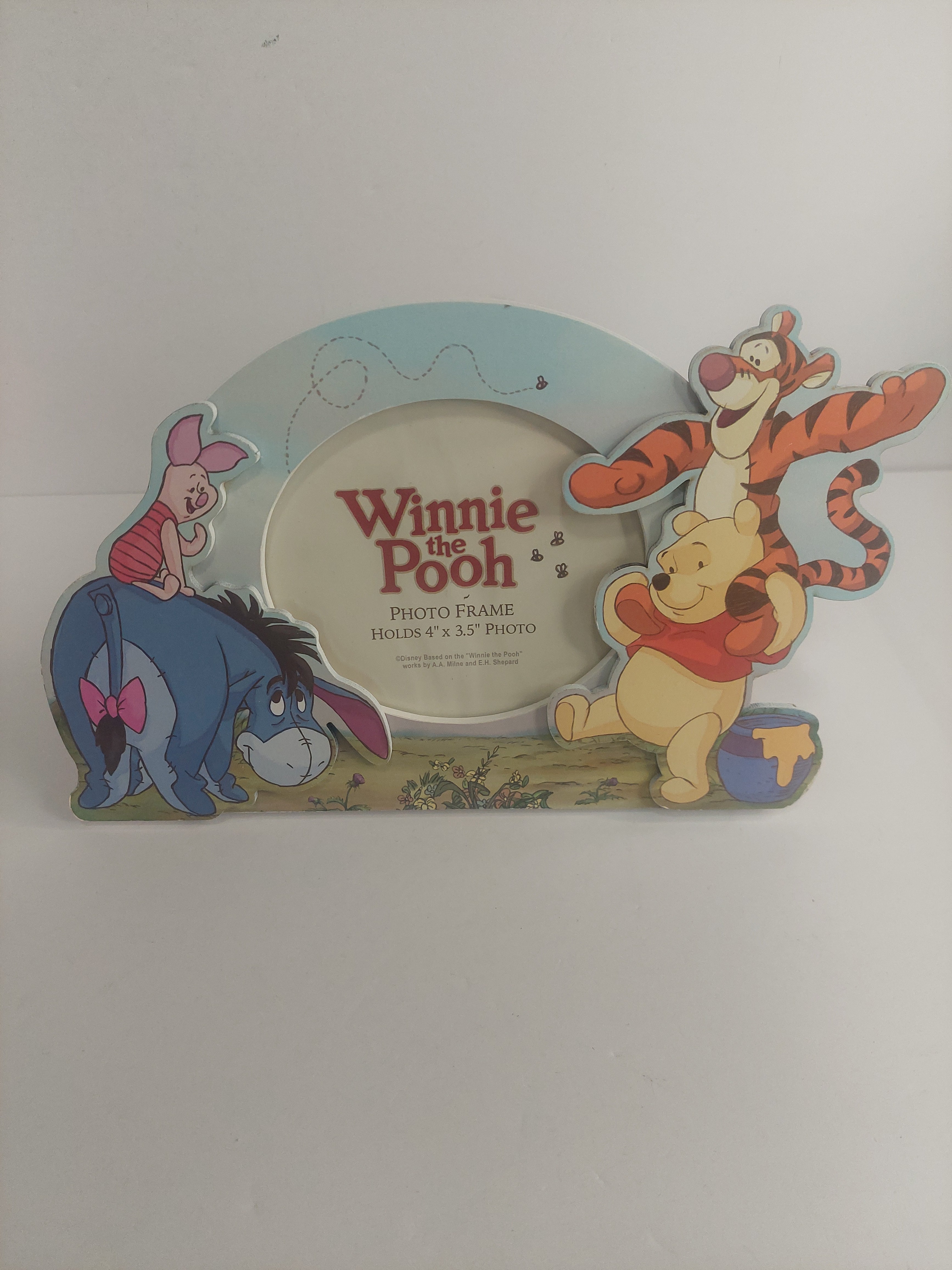 Winnie the Pooh and friends decorative frame on a white background